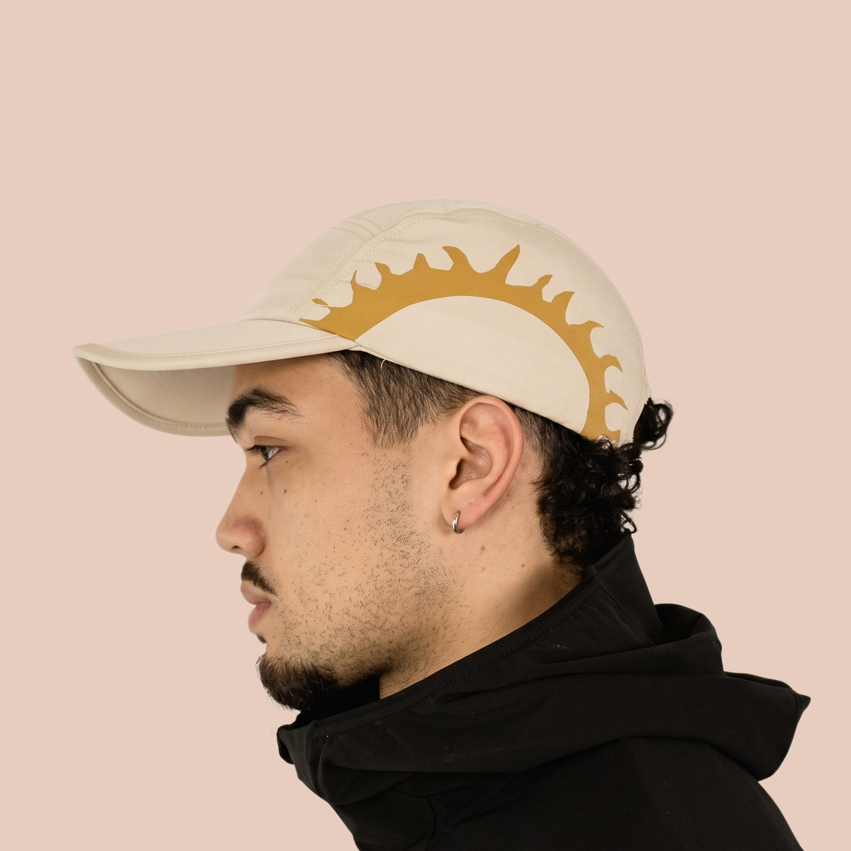 Man wearing the cream HOJA SOL Cap, side profile